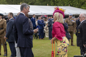 RAF and Afghanistan veteran JJ Adams enjoys a moment with Sir Timothy Laurence photographed by Jeff Gilbert