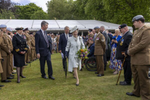 HRH The Princess Royal Princess Anne walks amongst the guests after receiving a bouquet flowers for the final Beating Retreat inside Buckingham Palace Gardens at The Not Forgotten Garden Party photographed by Jeff Gilbert London based photographer